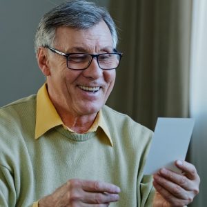 portrait-old-man-ecstatic-grandpa-with-glasses-sits-at-home-indoors-receives-envelope-letter.jpg